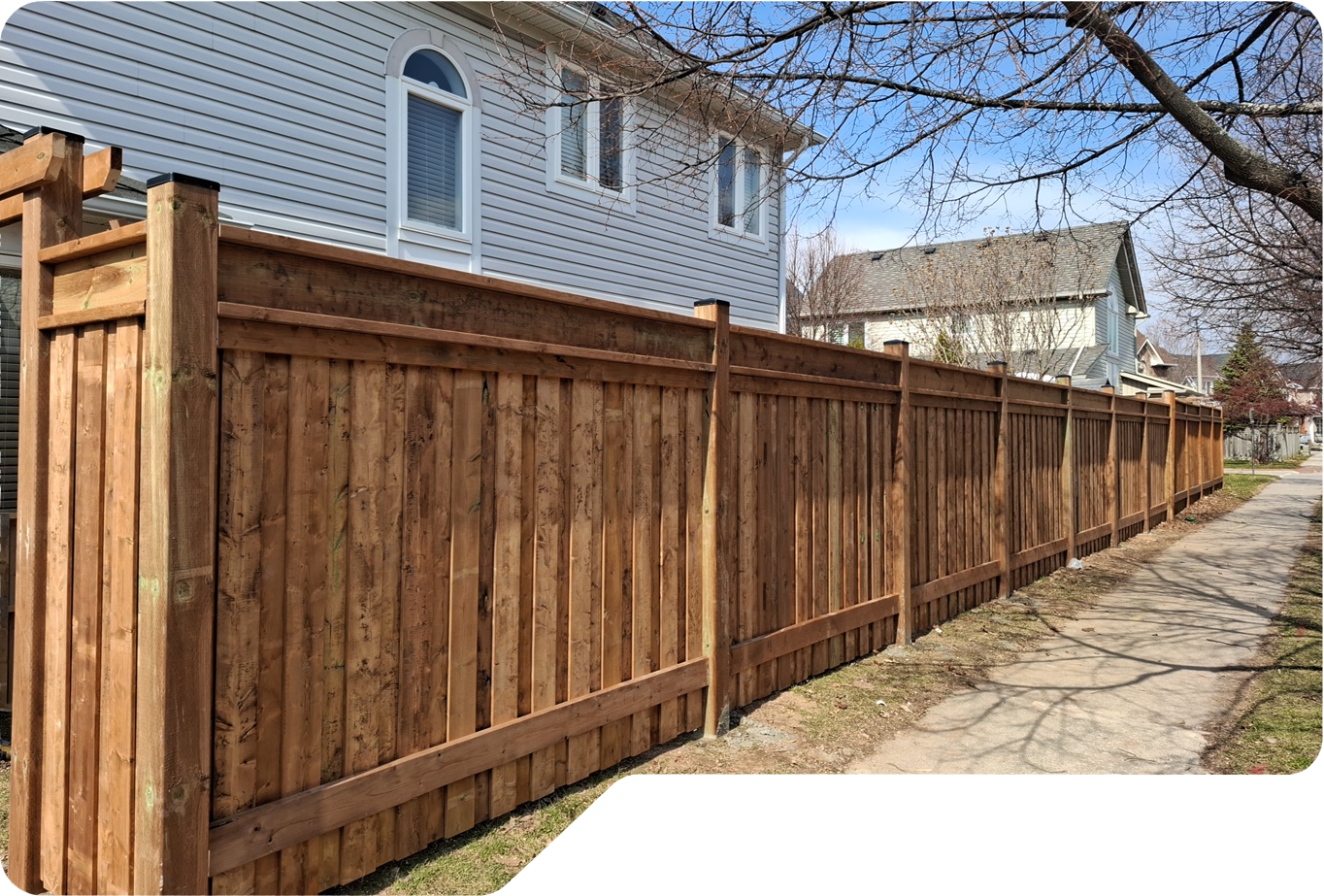 Wood privacy fence installed beside a Niagara home