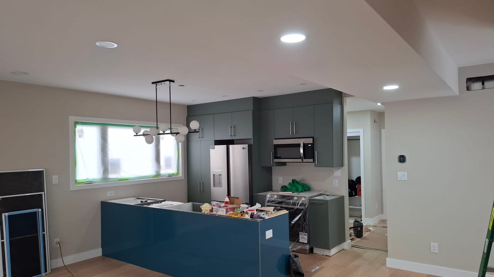 Finished kitchen renovation with a view across the updated cabinetry and island