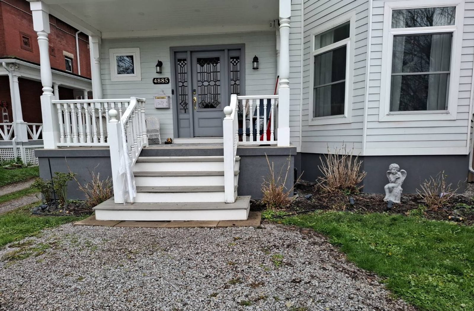Completed porch with dark gray parged foundation after refresh