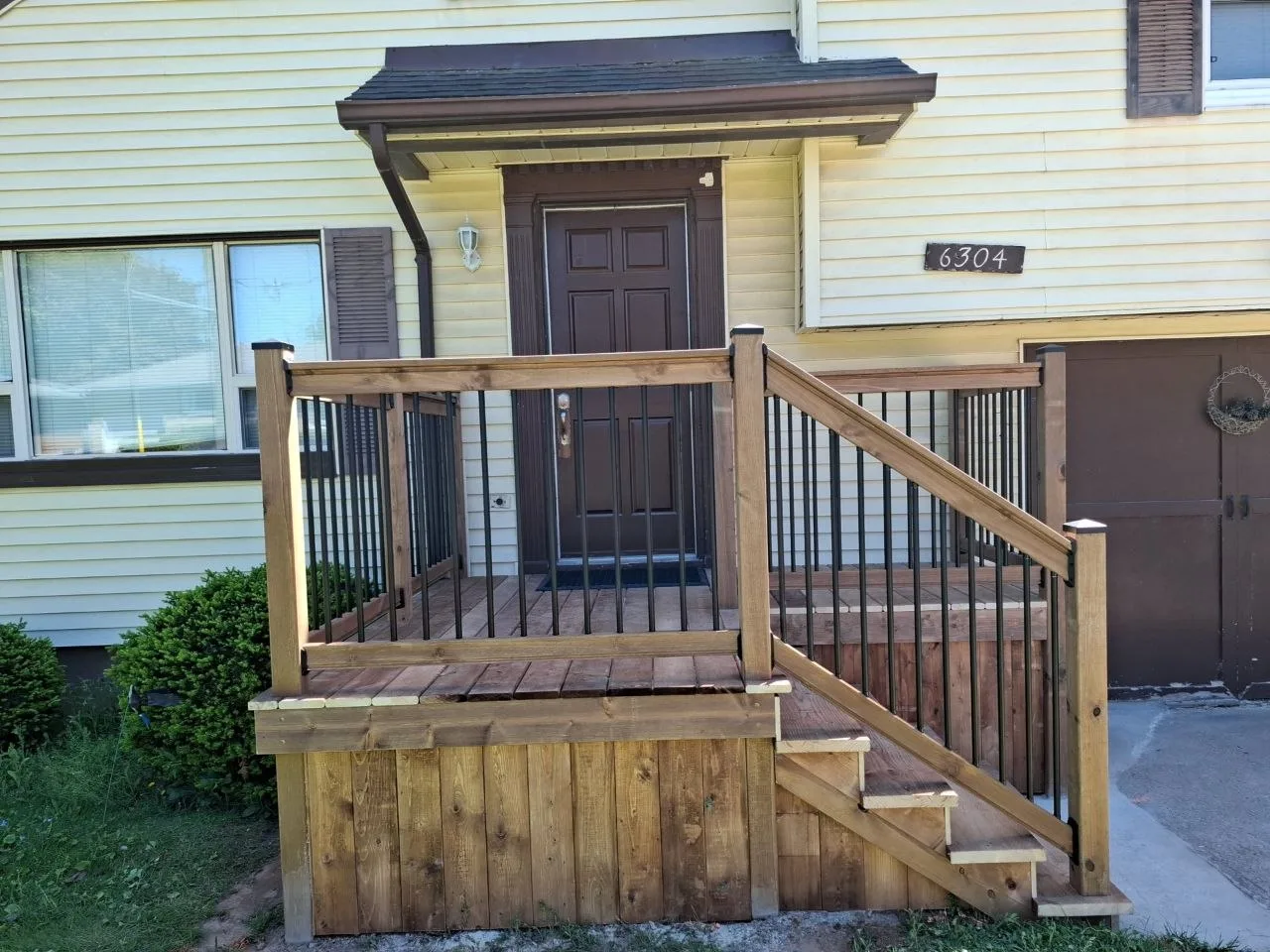 Front deck rebuild in Niagara Falls — decking and finish